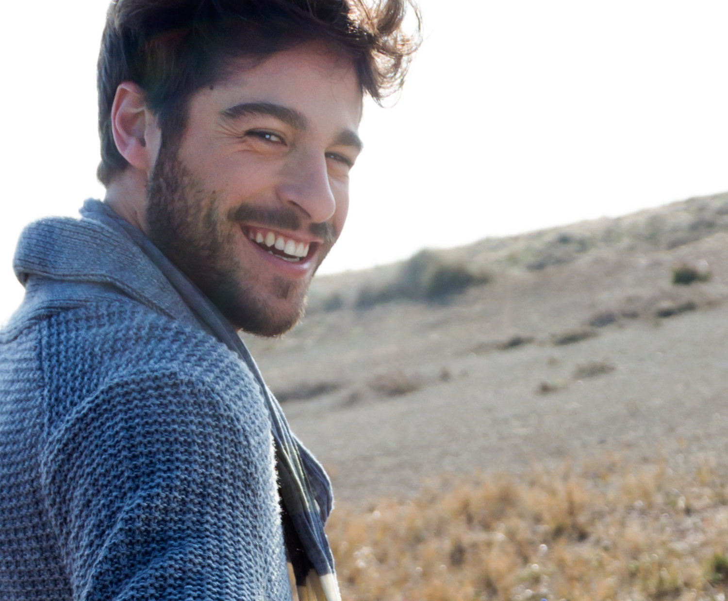 man smiling at beach